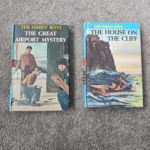 Vintage copies of the Hardy Boys mystery books by Franklin W. Dixon.